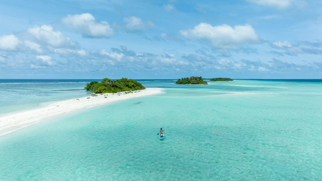 Tahiti vs Maldives: Which Island Paradise Is Right for You? 1 ishan seefromthesky YWygW8dmF70 unsplash